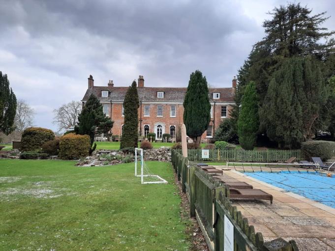 large home with pool outside